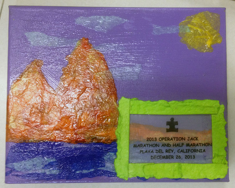 Front of the award, hand-made by a resident of L'Arche Mobile.